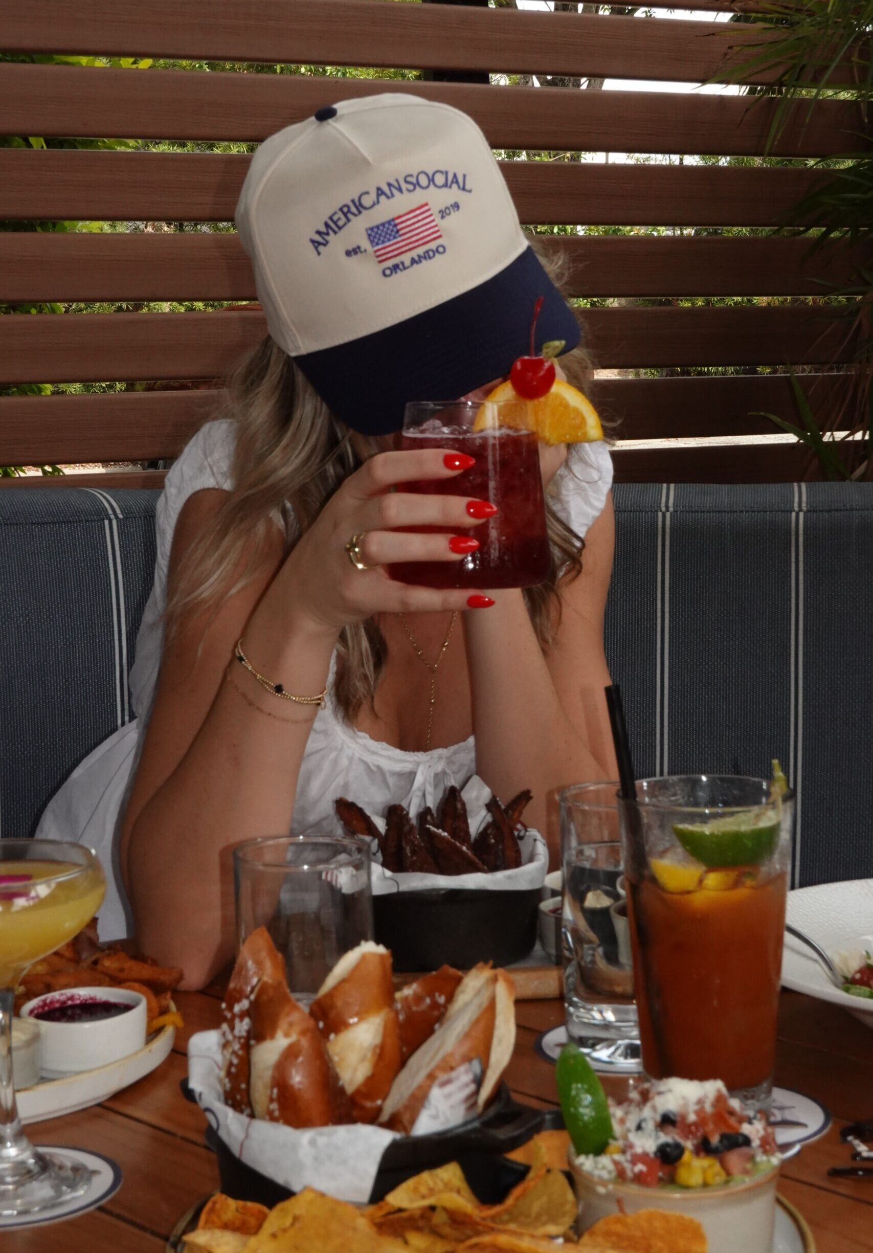 A woman wearing a cap that says 