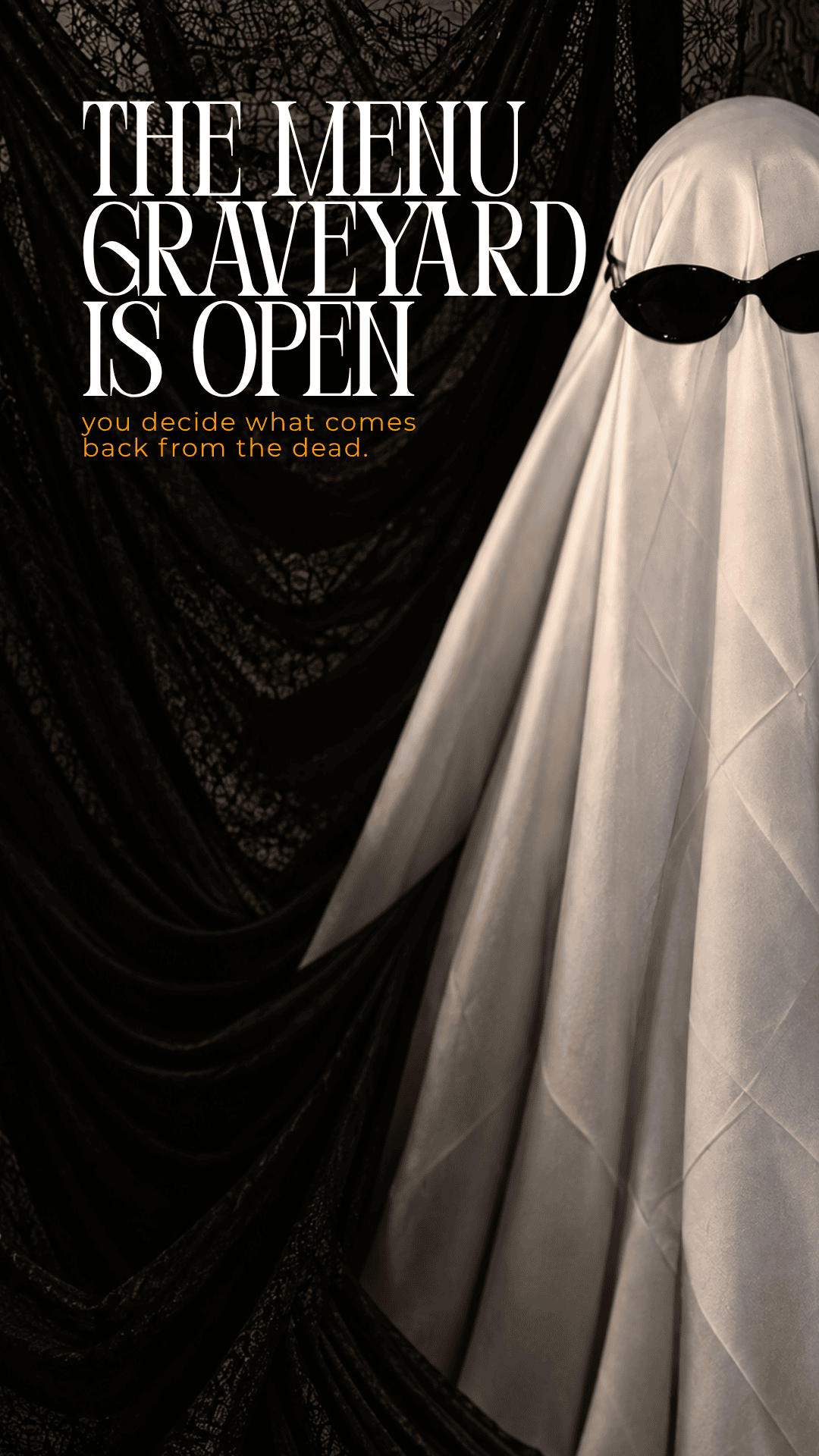 A person in a sheet ghost costume wearing sunglasses stands before a black curtain, with text that reads “The Menu Graveyard is open, you decide what comes back from the dead” at the event.
